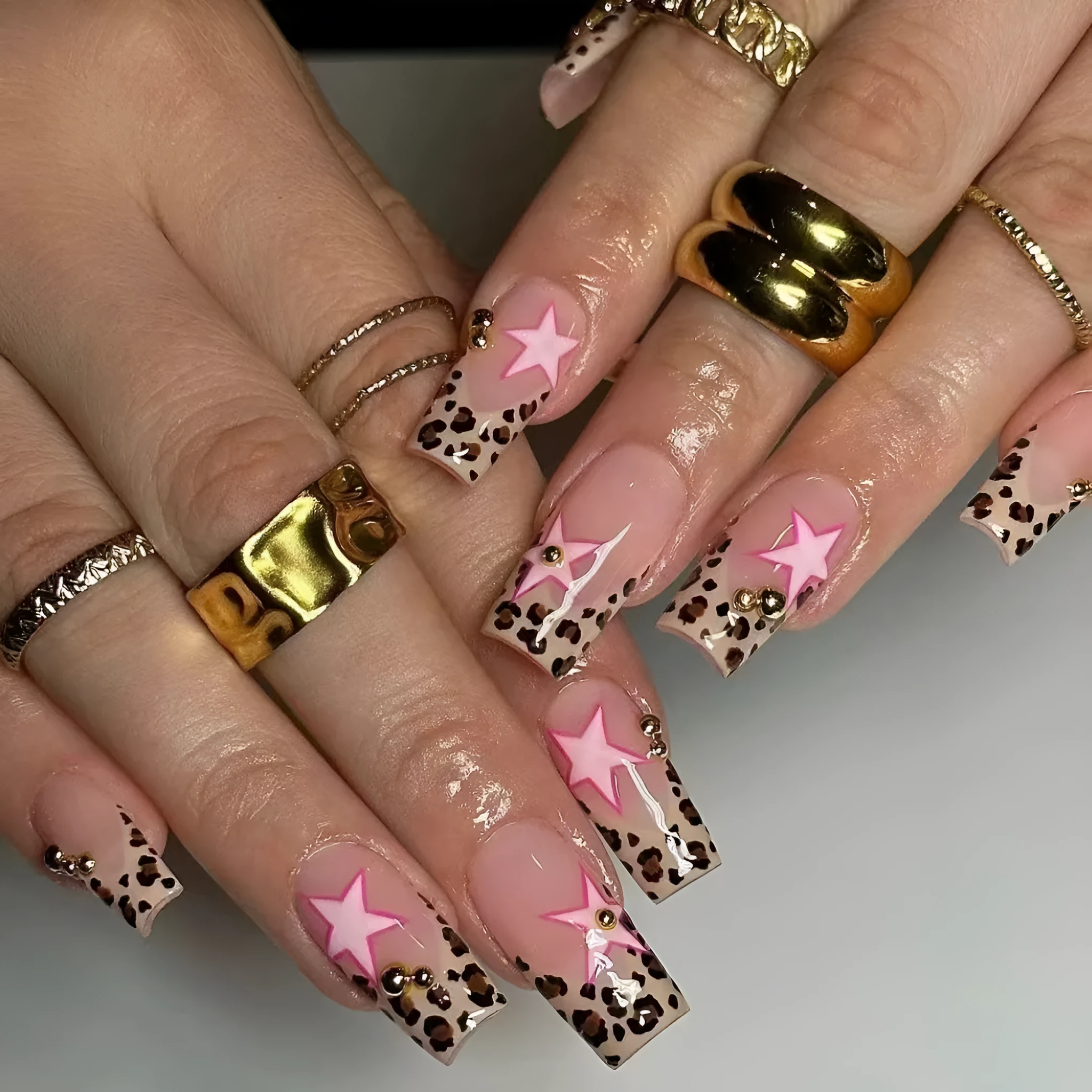 French manicure press on nails with leopard print pattern, star and pearl diamond accents
