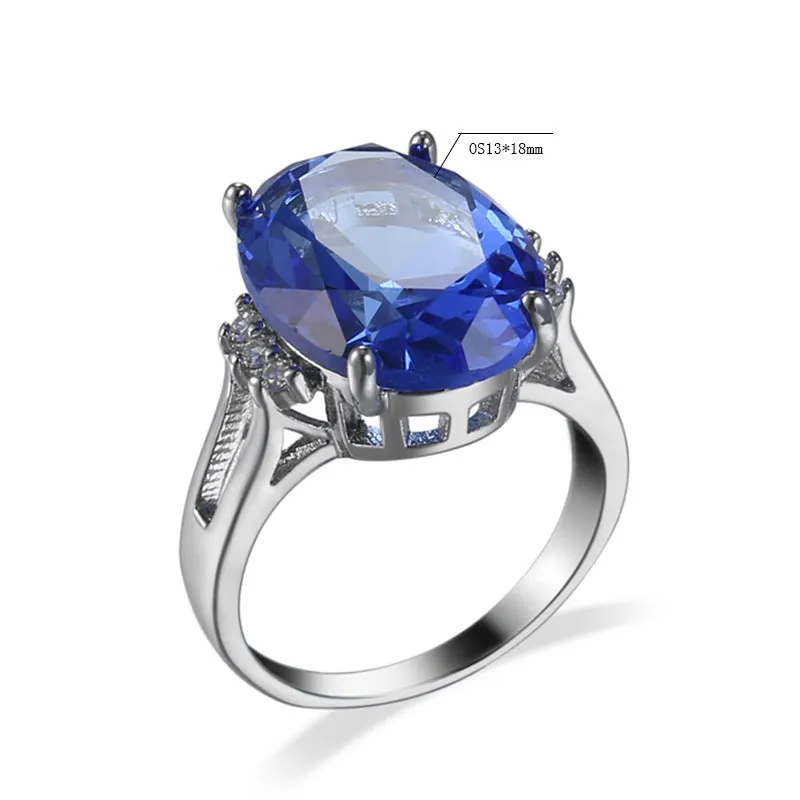 Geometric ellipse shaped zircon ring in electroplated blue black or medium blue copper, showing retro unisex style.
