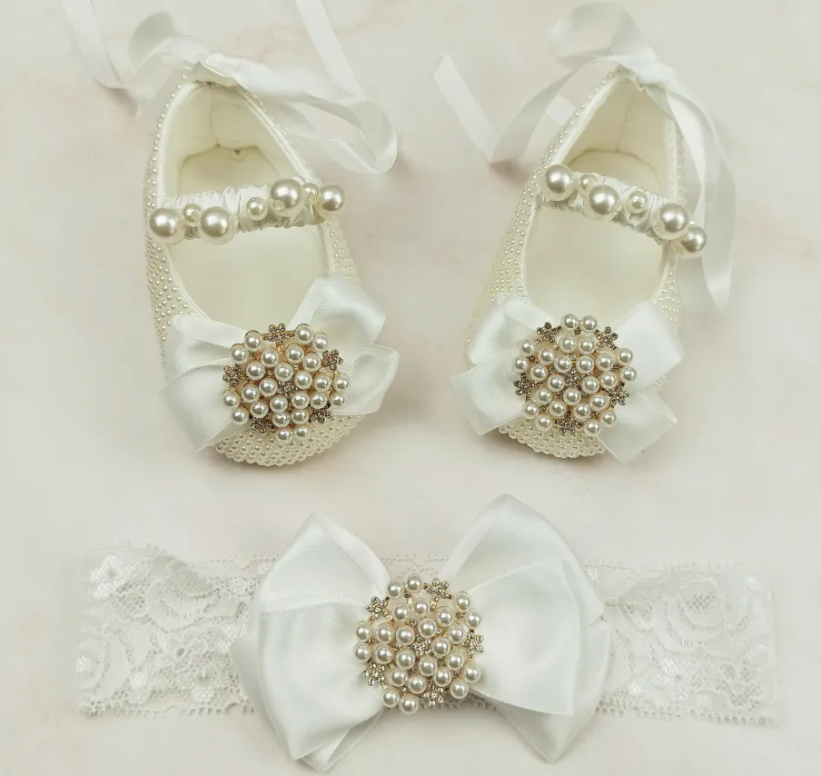 Milky white handmade soft sole cloth princess shoes with pearl detailing and lace-up closure for babies