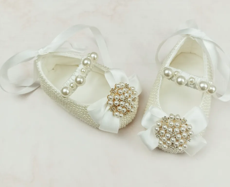 Milky white handmade soft sole cloth princess shoes with pearl detailing and lace-up closure for babies