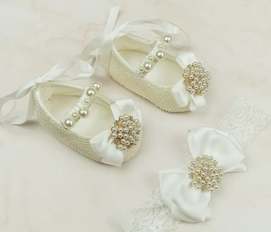 Milky white handmade soft sole cloth princess shoes with pearl detailing and lace-up closure for babies