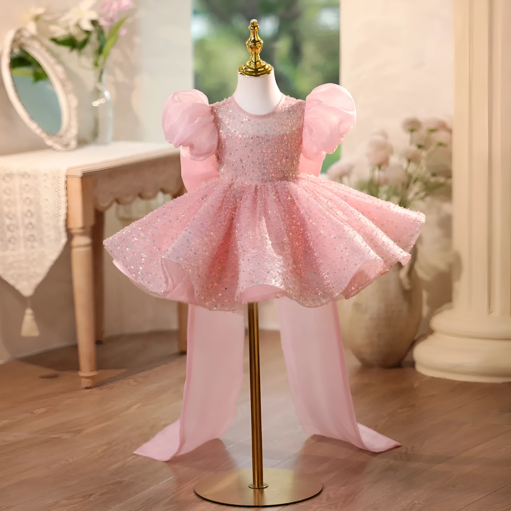 Children's sequined formal dress in pink with puff sleeves and princess-style silhouette for weddings and parties