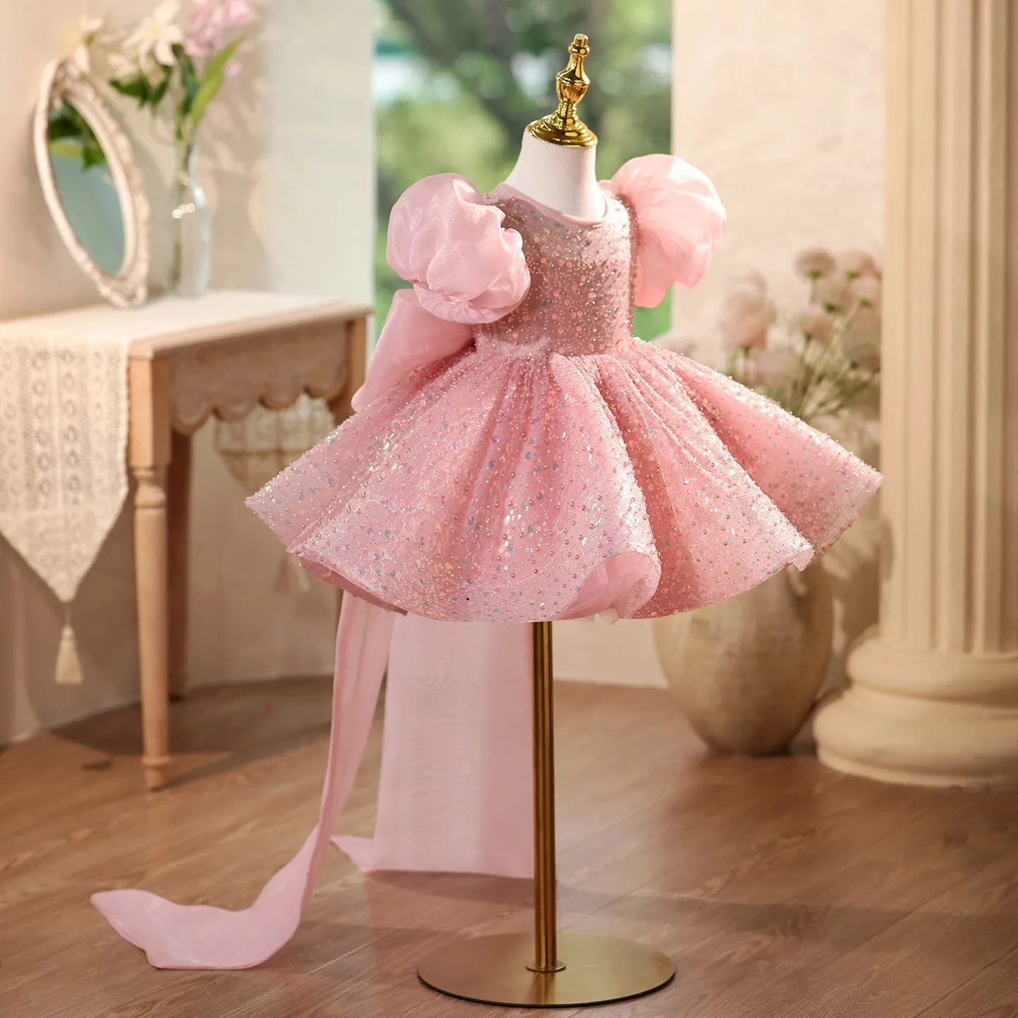Children's sequined formal dress in pink with puff sleeves and princess-style silhouette for weddings and parties