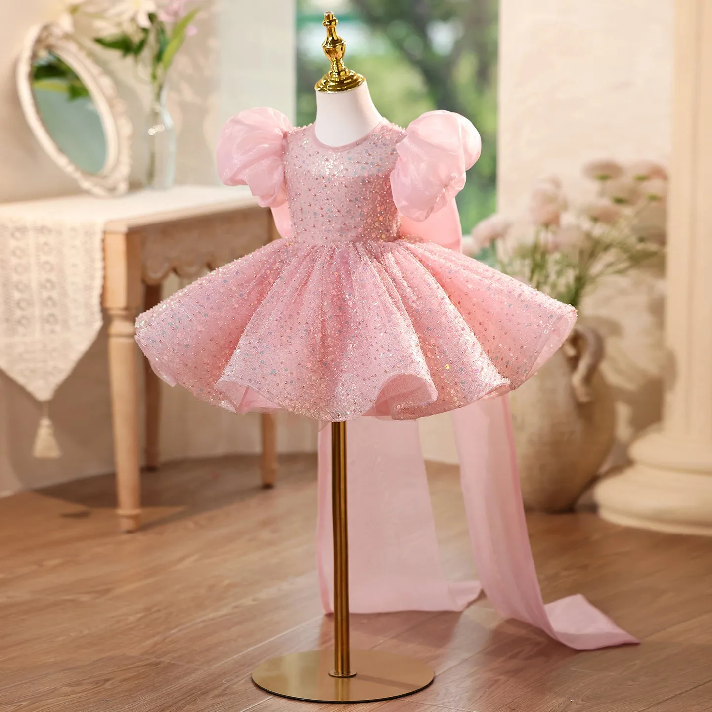 Children's sequined formal dress in pink with puff sleeves and princess-style silhouette for weddings and parties