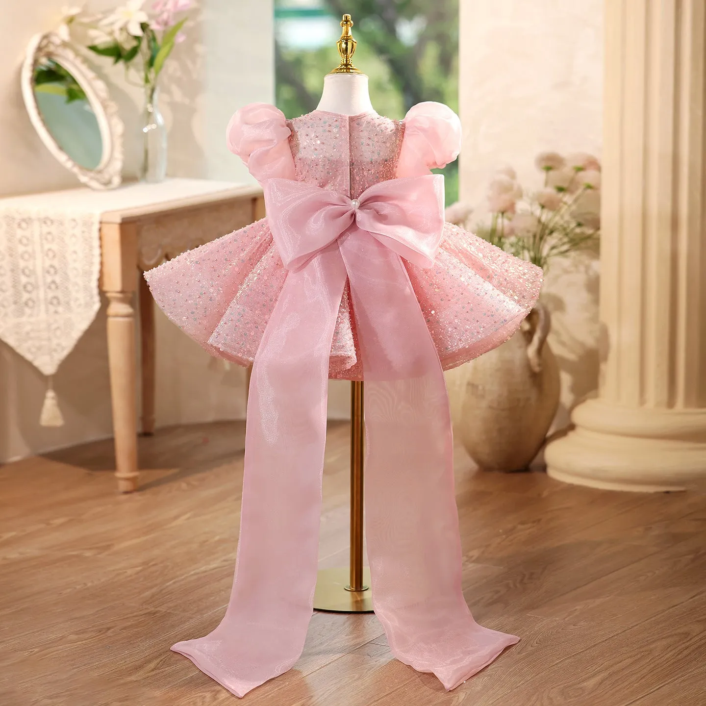 Children's sequined formal dress in pink with puff sleeves and princess-style silhouette for weddings and parties