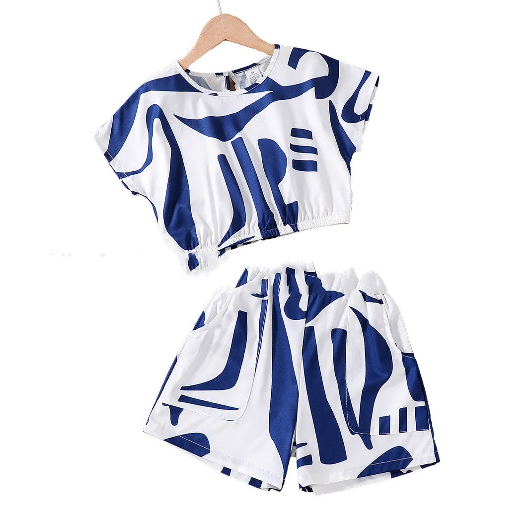 Zebra print short sleeve top and wide leg shorts suit for girls in black and white, side view on hanger