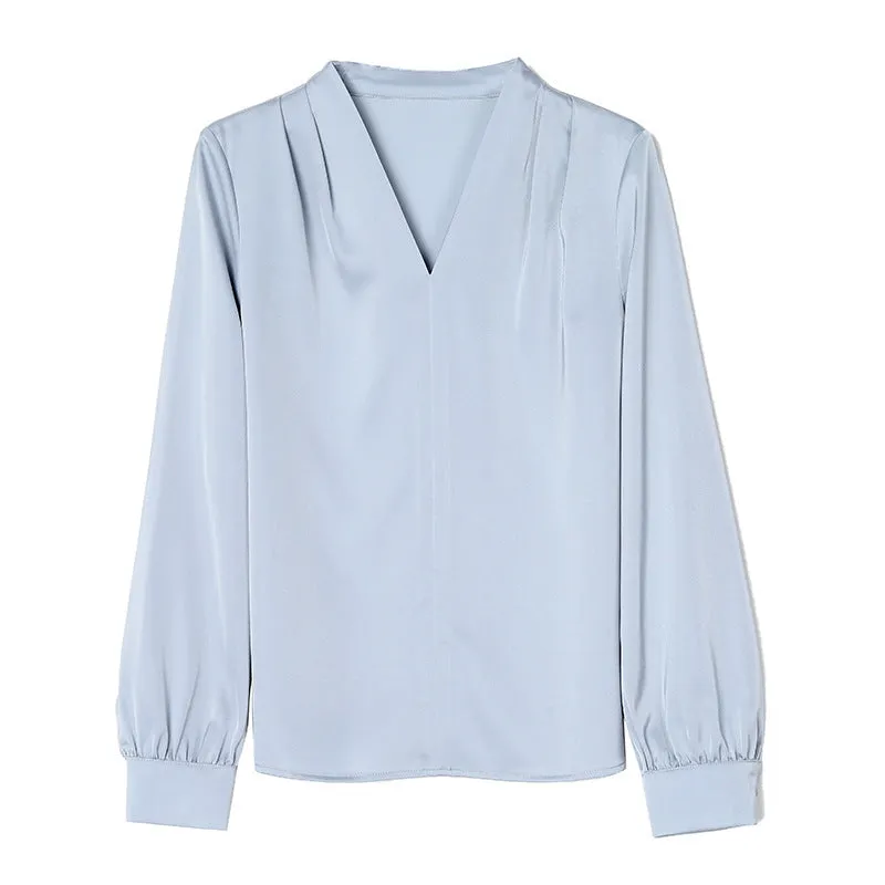 Blue slim fit long sleeve women's satin shirt with 3D stitching on a hanger.