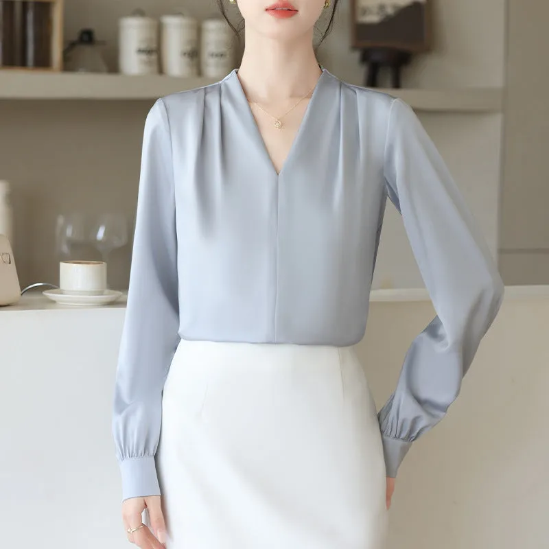 Blue slim fit long sleeve women's satin shirt with 3D stitching on a hanger.