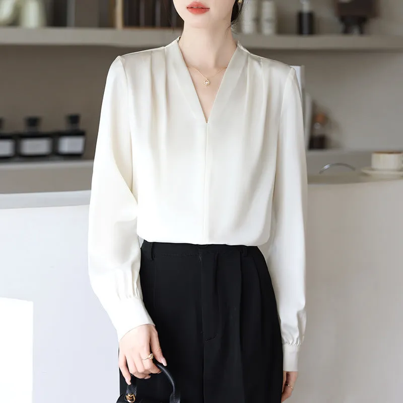 Blue slim fit long sleeve women's satin shirt with 3D stitching on a hanger.