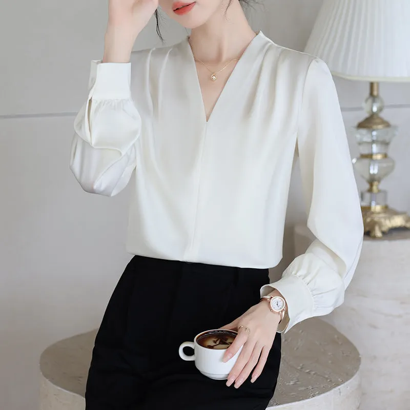 Blue slim fit long sleeve women's satin shirt with 3D stitching on a hanger.
