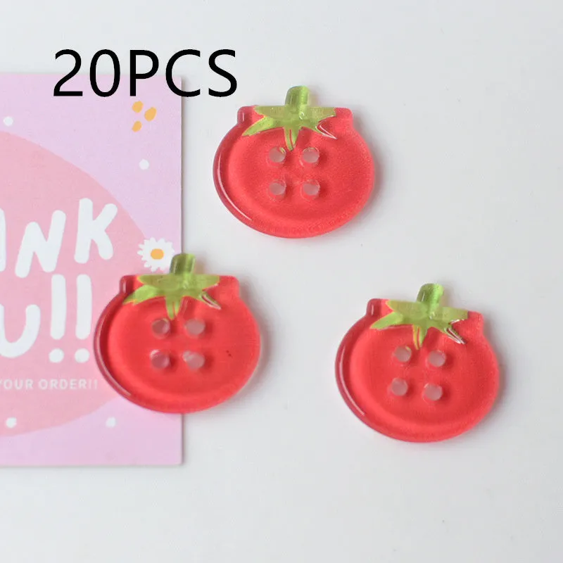 A pack of medium-sized plastic tomato button ornaments in mixed colours including red plaid and cherry tomato print.