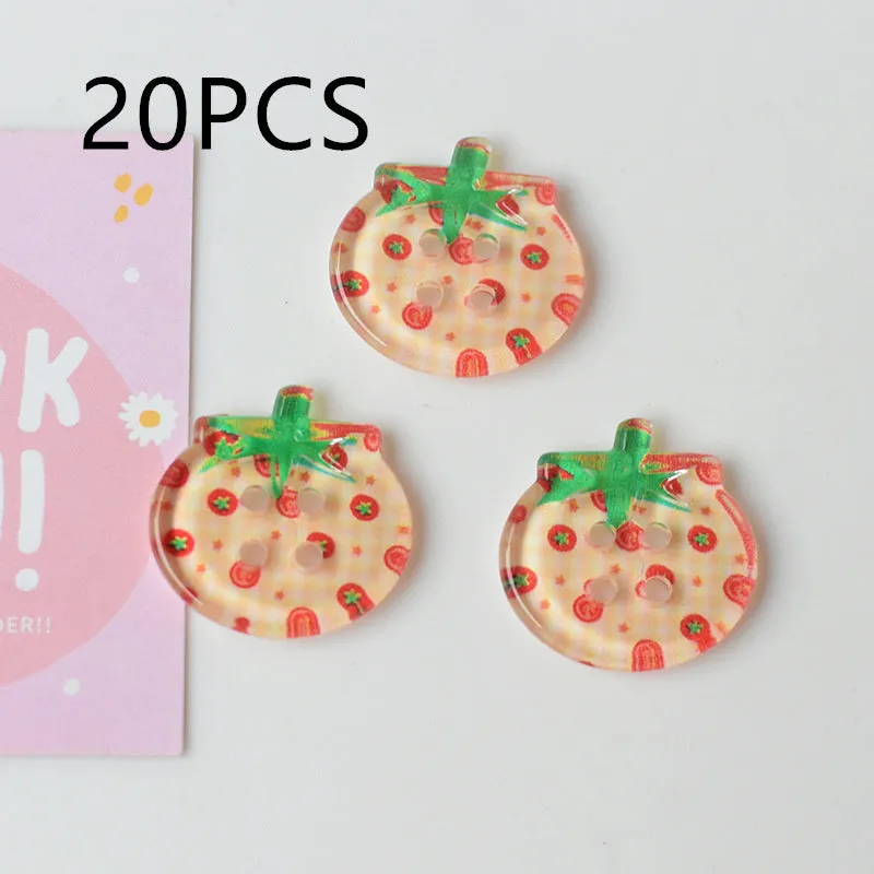 A pack of medium-sized plastic tomato button ornaments in mixed colours including red plaid and cherry tomato print.