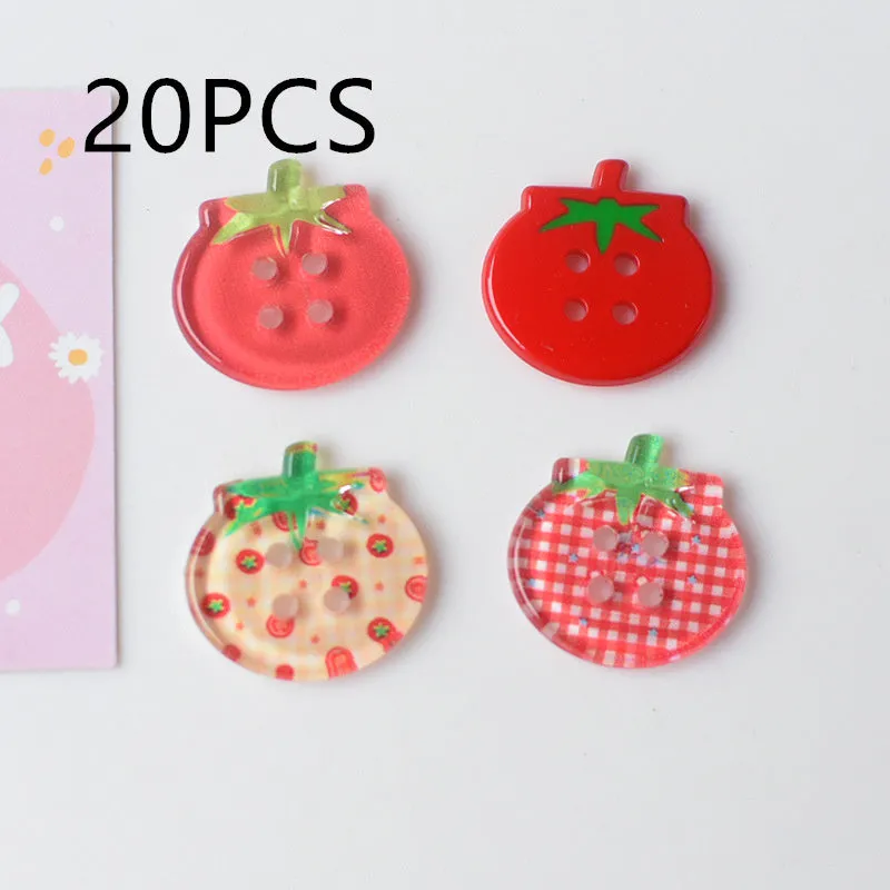 A pack of medium-sized plastic tomato button ornaments in mixed colours including red plaid and cherry tomato print.