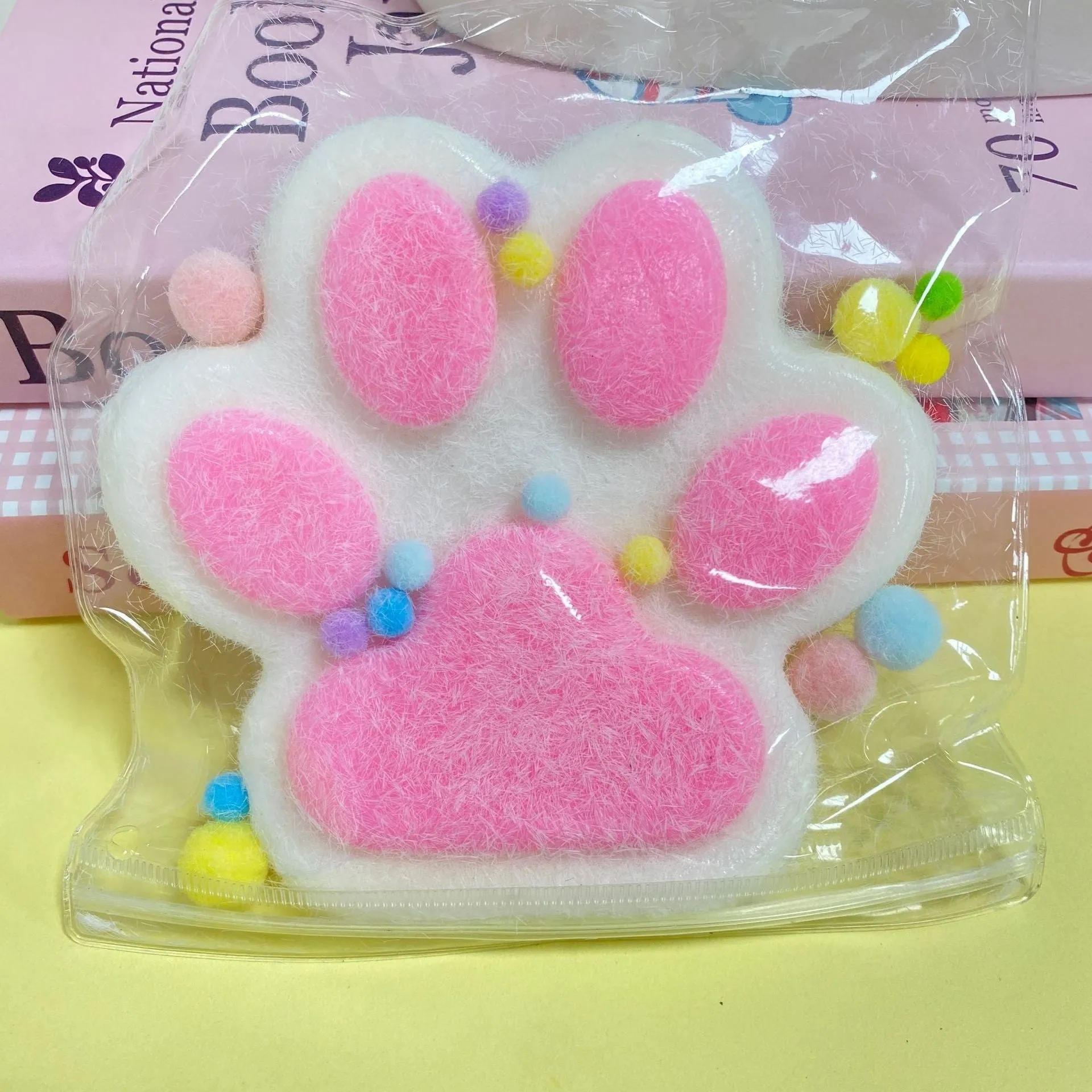 Oversized plush cat's paw squeezing toy in 14cm TPR flocking finish, black colour, on white background