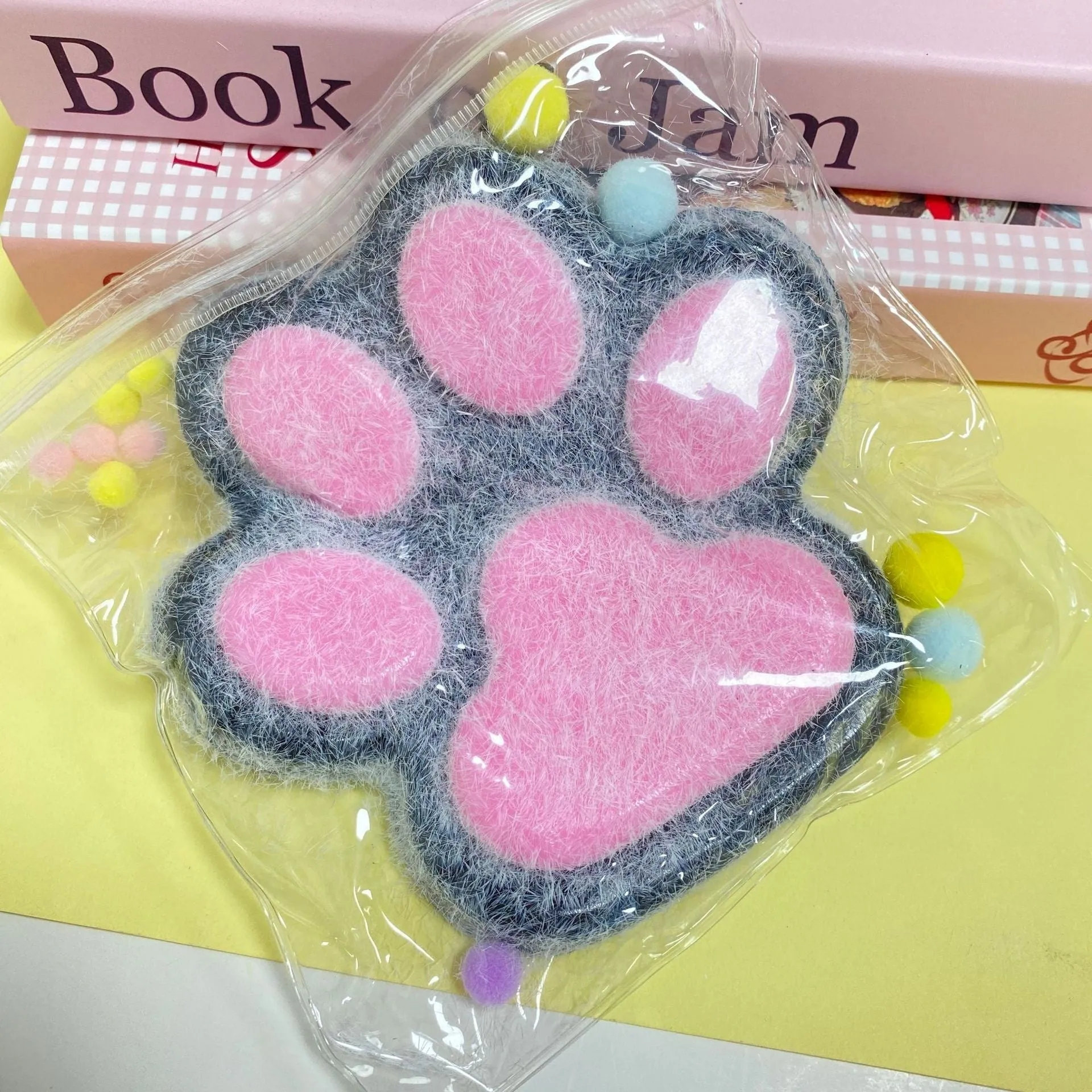 Oversized plush cat's paw squeezing toy in 14cm TPR flocking finish, black colour, on white background