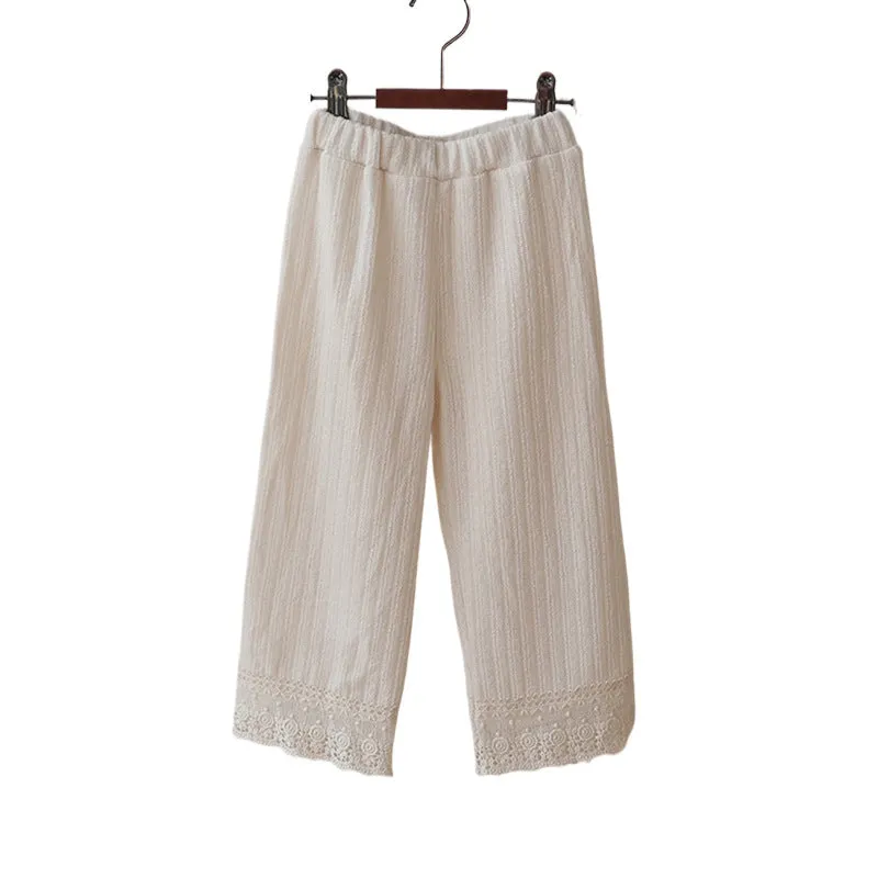 Girls loose knitted lace trim straight-leg trousers in pink, apricot, and white colours