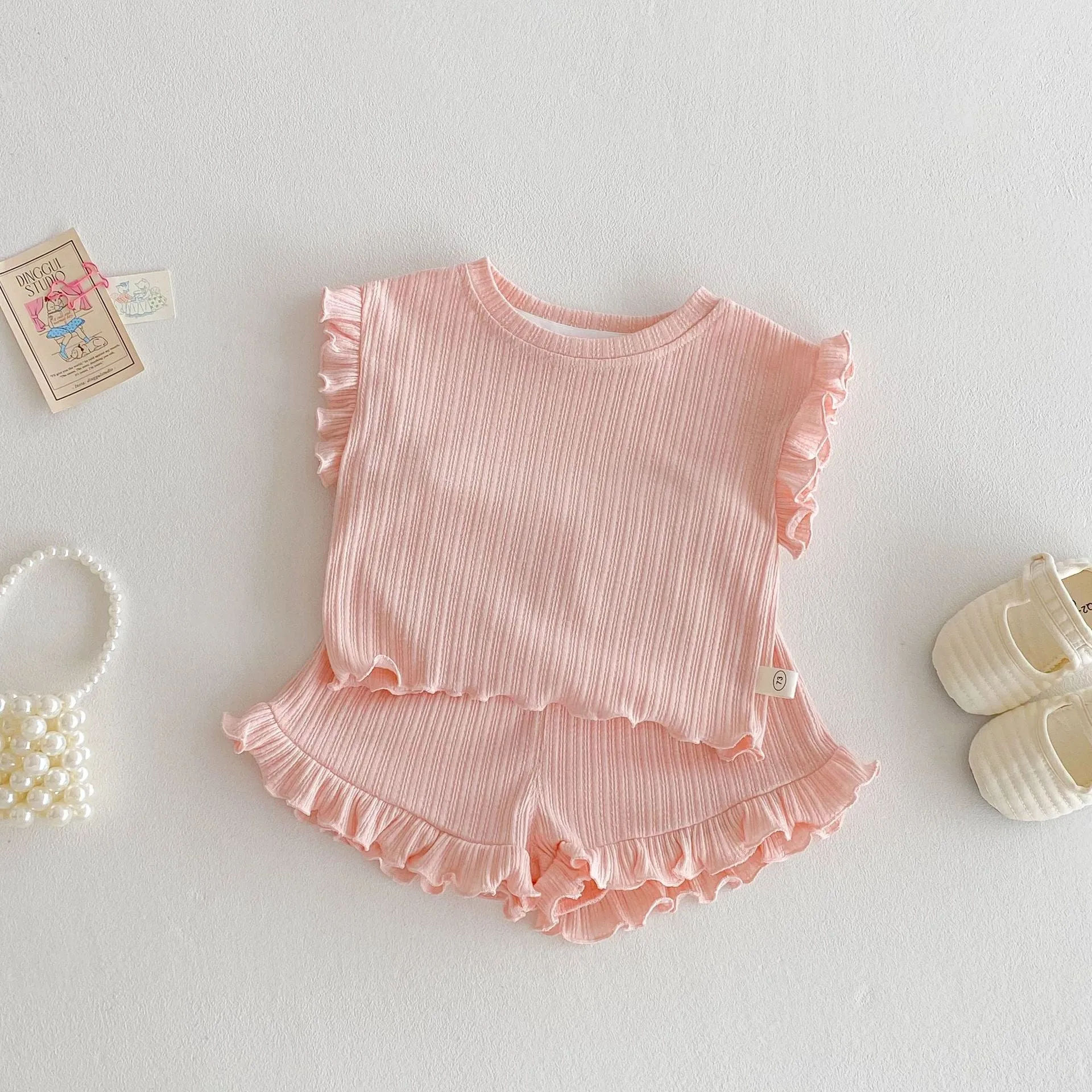 Baby girl two-piece cotton shorts set in light beige with wooden ear vest top and matching shorts