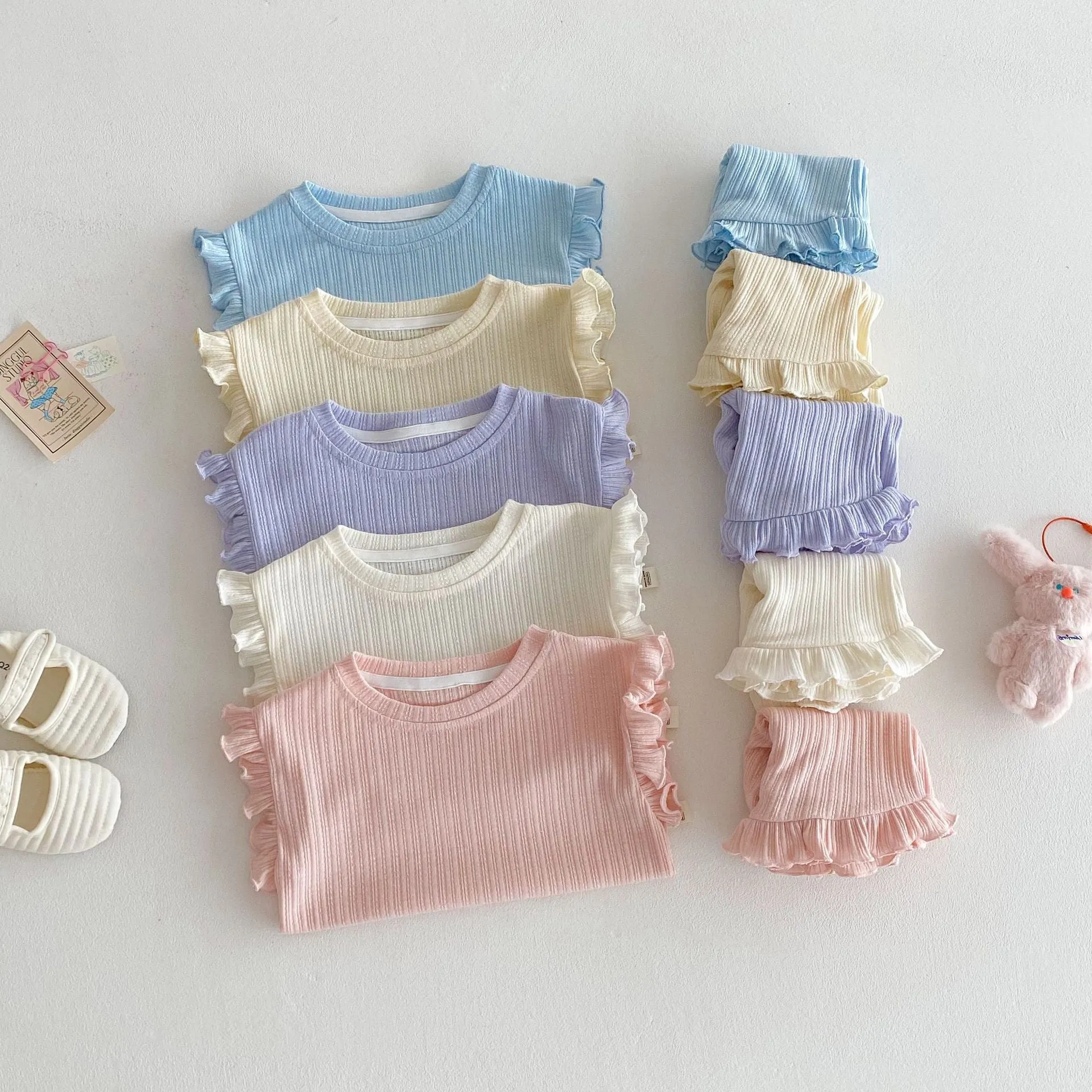 Baby girl two-piece cotton shorts set in light beige with wooden ear vest top and matching shorts