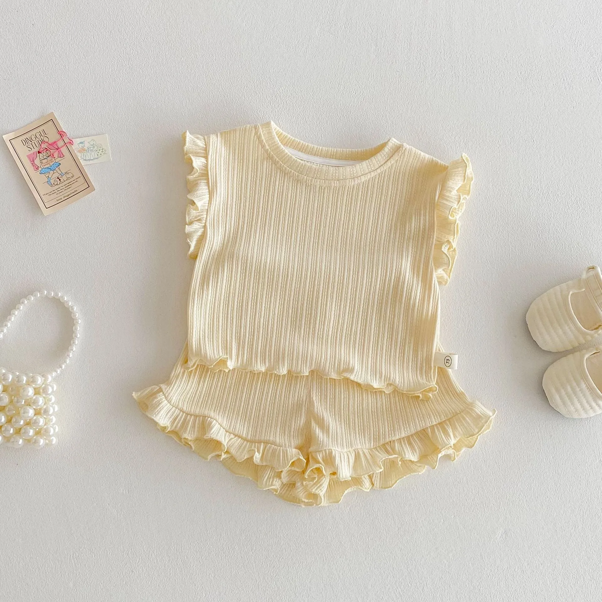 Baby girl two-piece cotton shorts set in light beige with wooden ear vest top and matching shorts