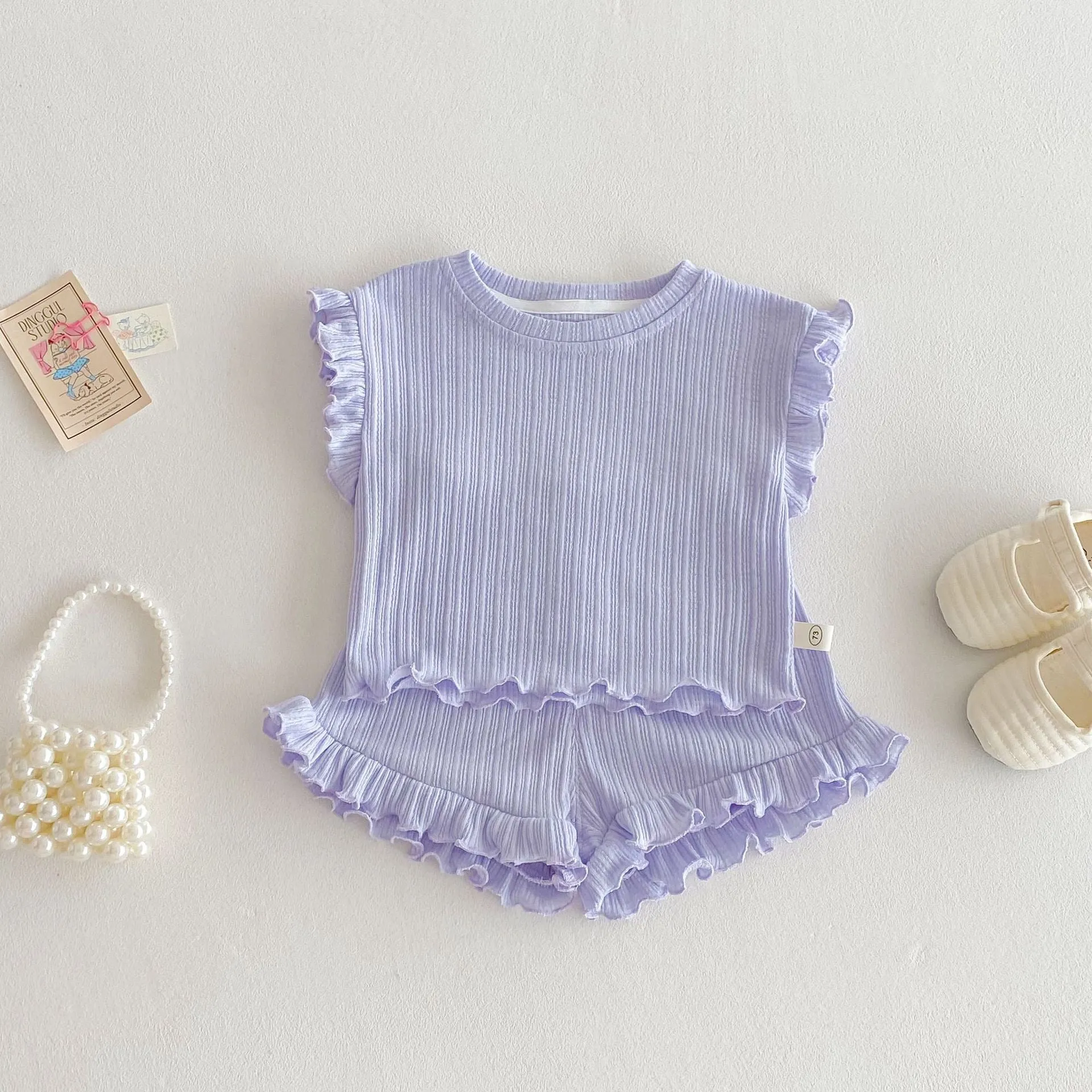 Baby girl two-piece cotton shorts set in light beige with wooden ear vest top and matching shorts