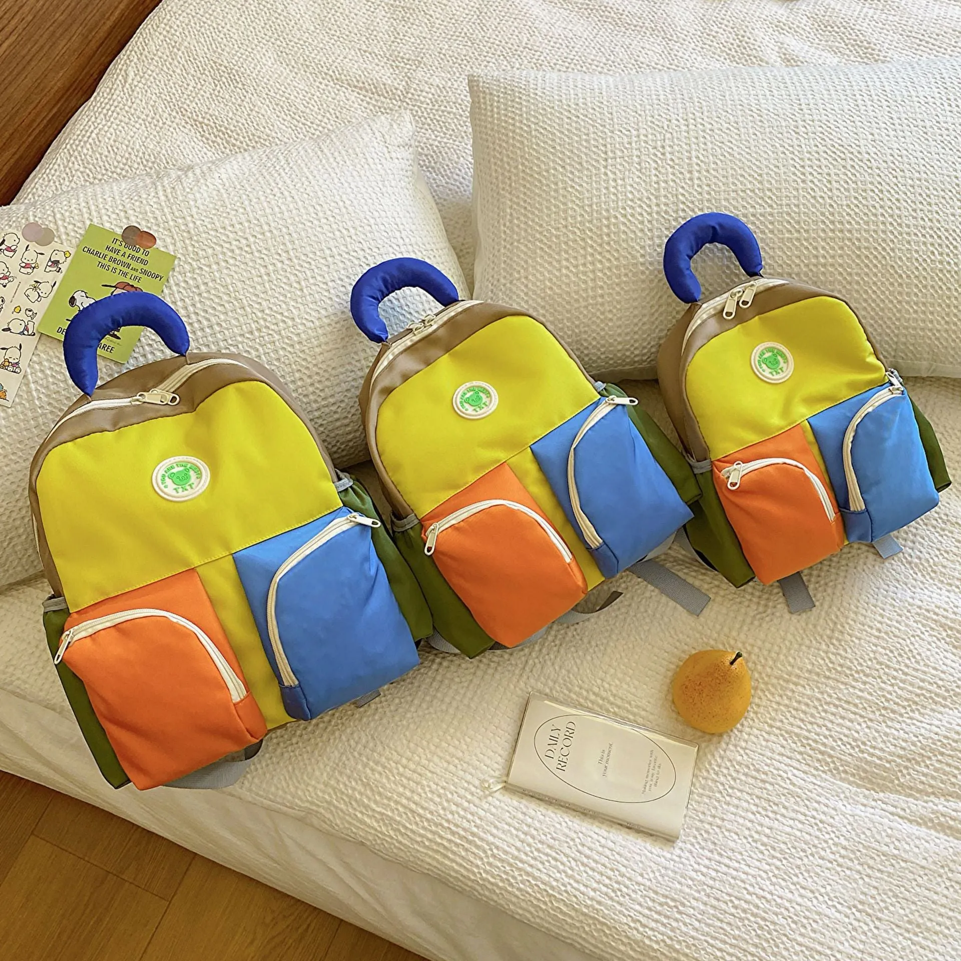 Children's trendy backpack in solid colour, lightweight Oxford cloth, blue pink yellow sizes small medium large