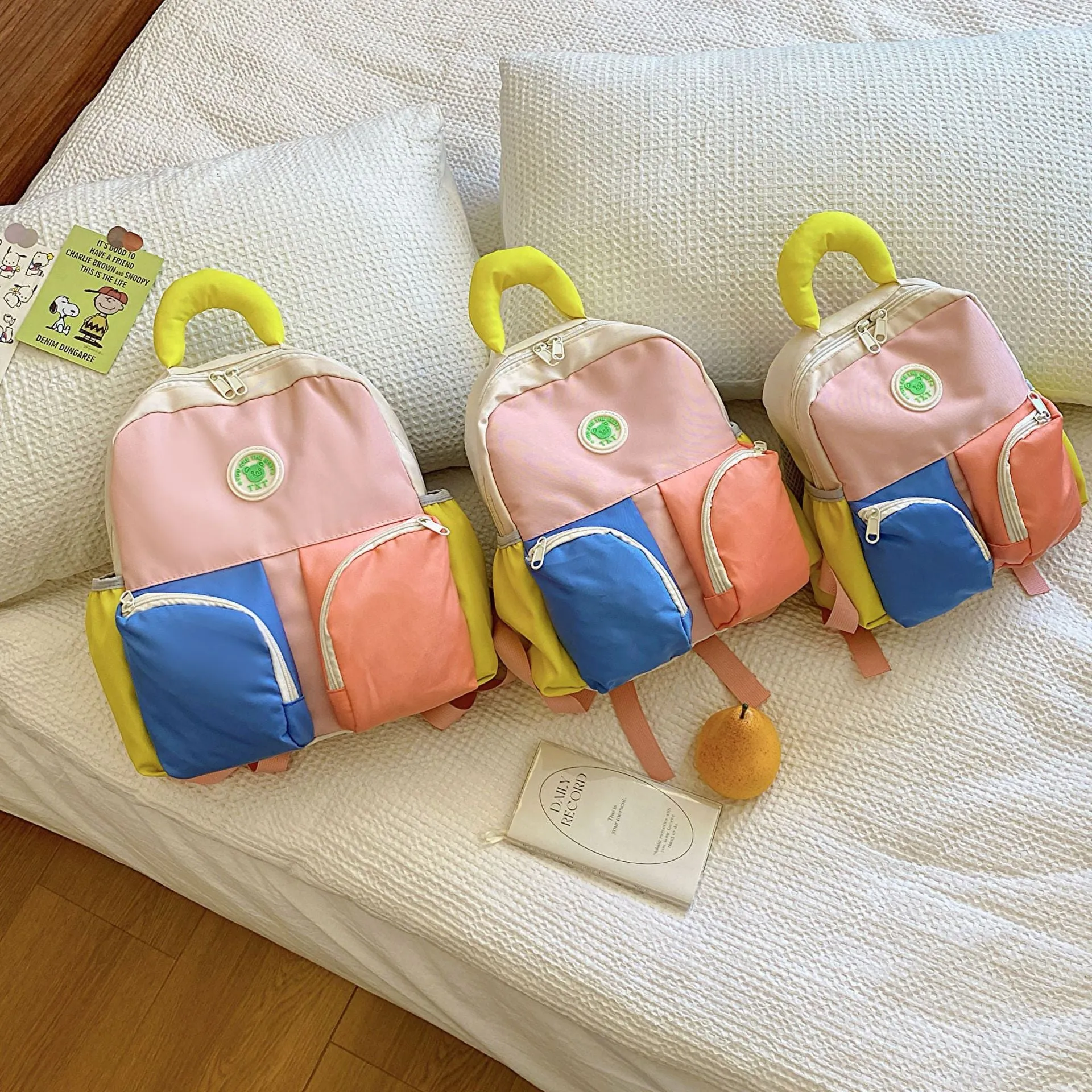 Children's trendy backpack in solid colour, lightweight Oxford cloth, blue pink yellow sizes small medium large