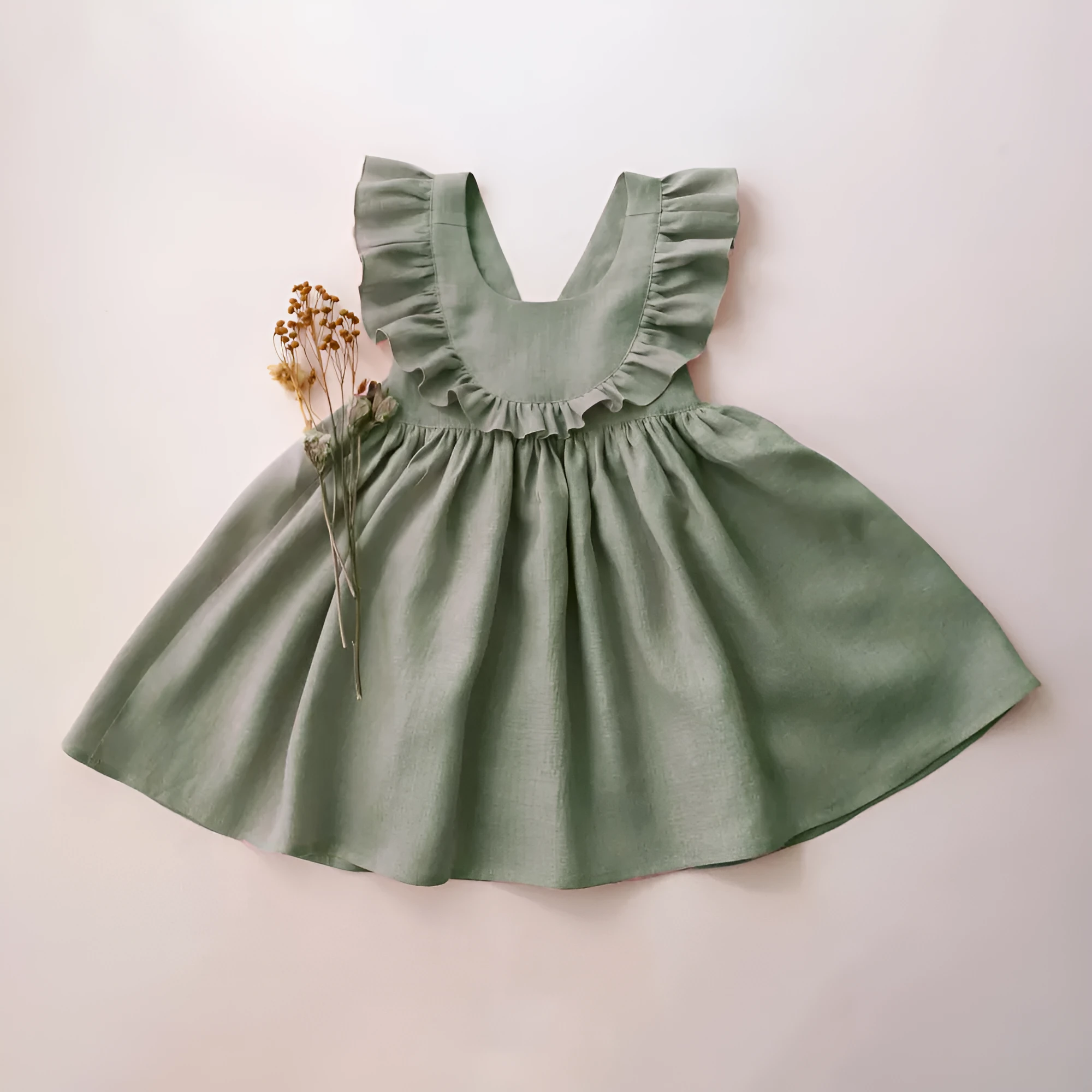 Baby girl's summer strap dress in green solid colour with A-line skirt and cotton lining