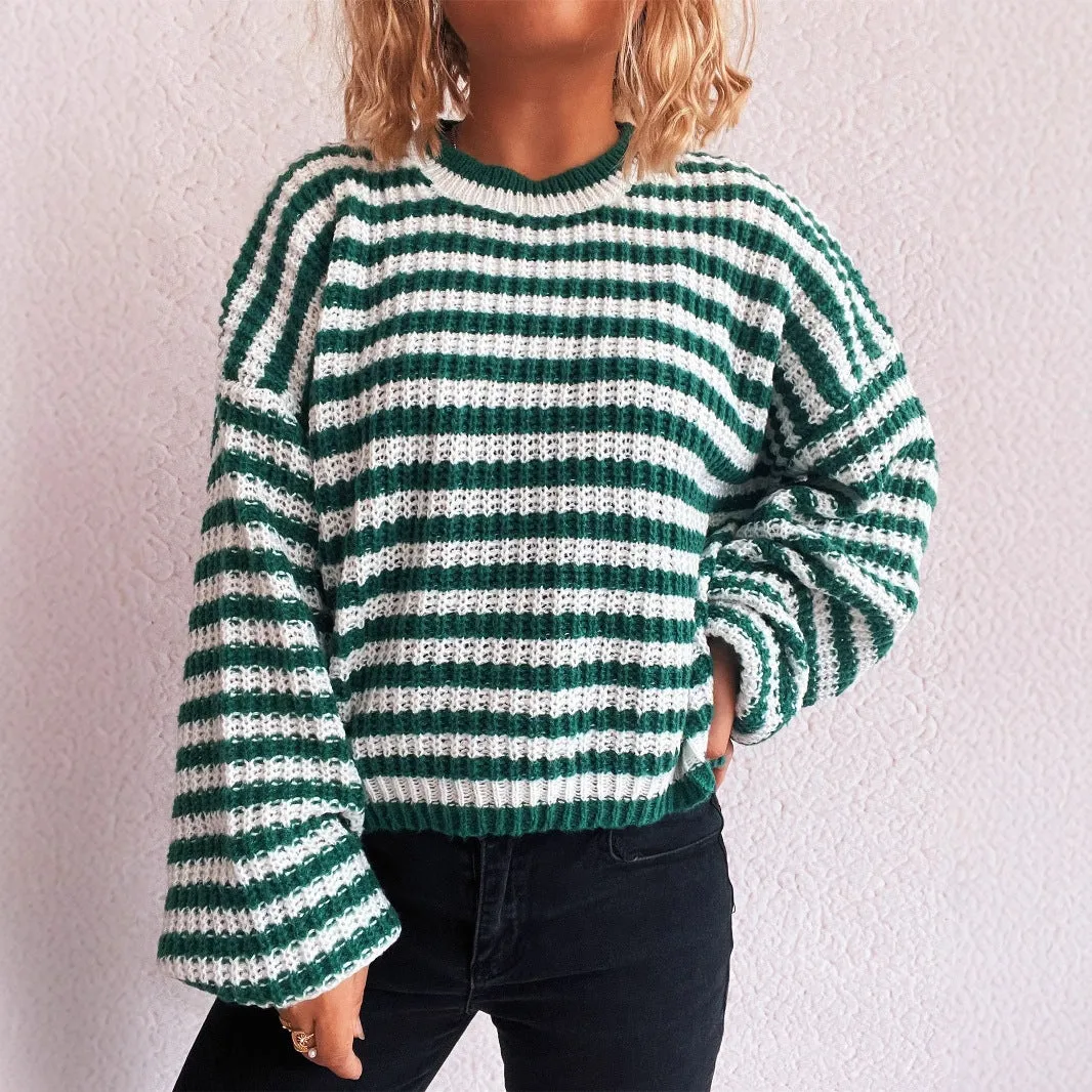 Vintage stripe women's loose fit pullover sweater in red, shown with long sleeves and a round neck.