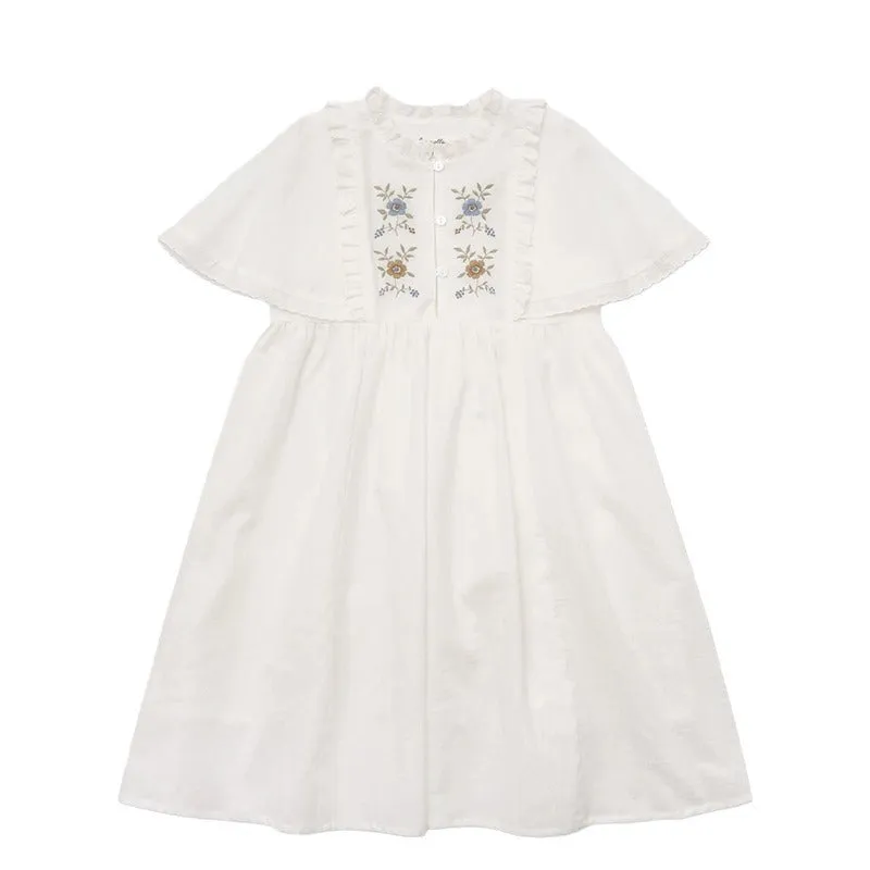 White washed cotton girls dress with short sleeves, ruffled and embroidered skirt for summer