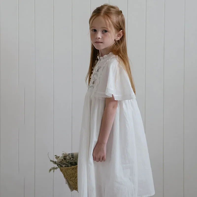 White washed cotton girls dress with short sleeves, ruffled and embroidered skirt for summer