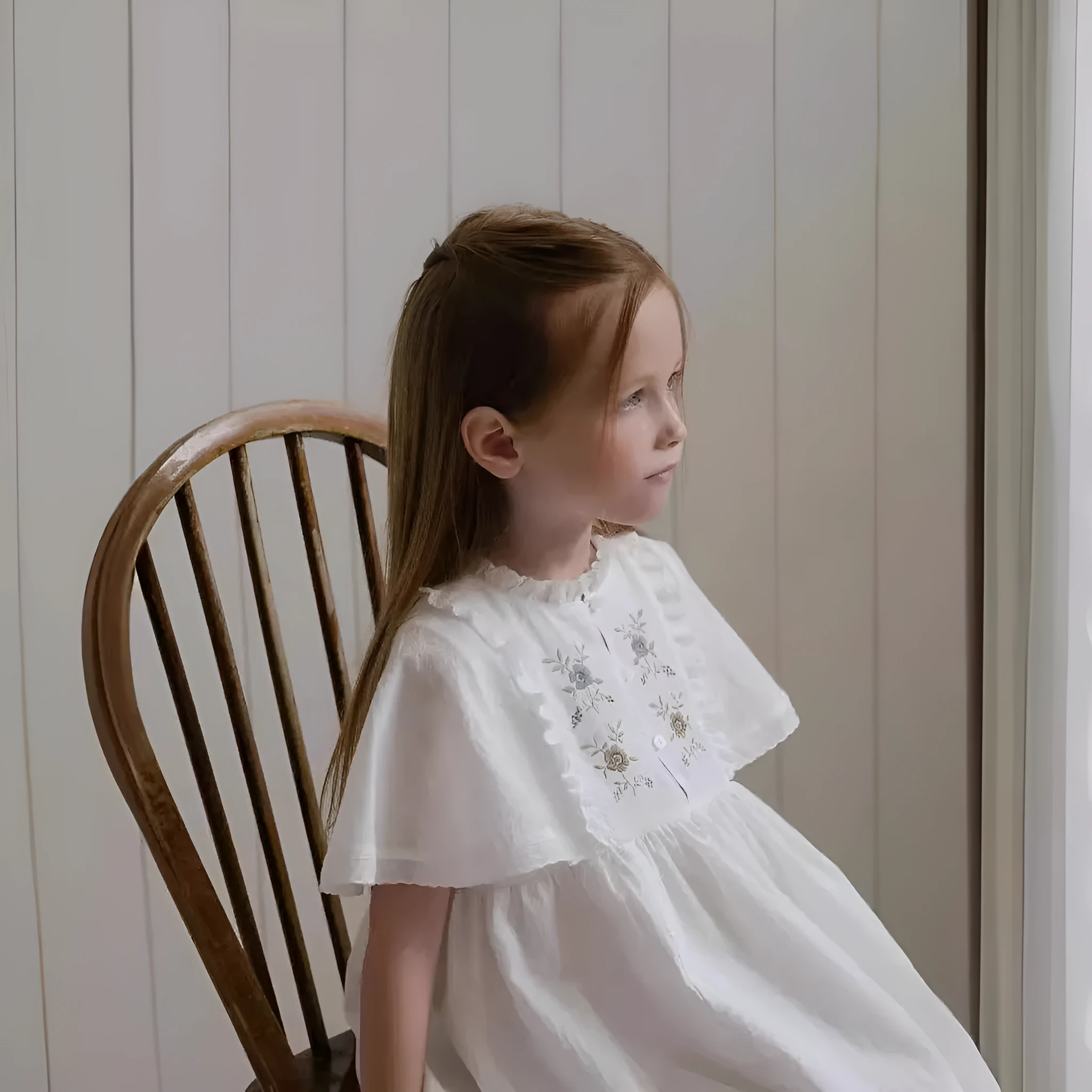 White washed cotton girls dress with short sleeves, ruffled and embroidered skirt for summer