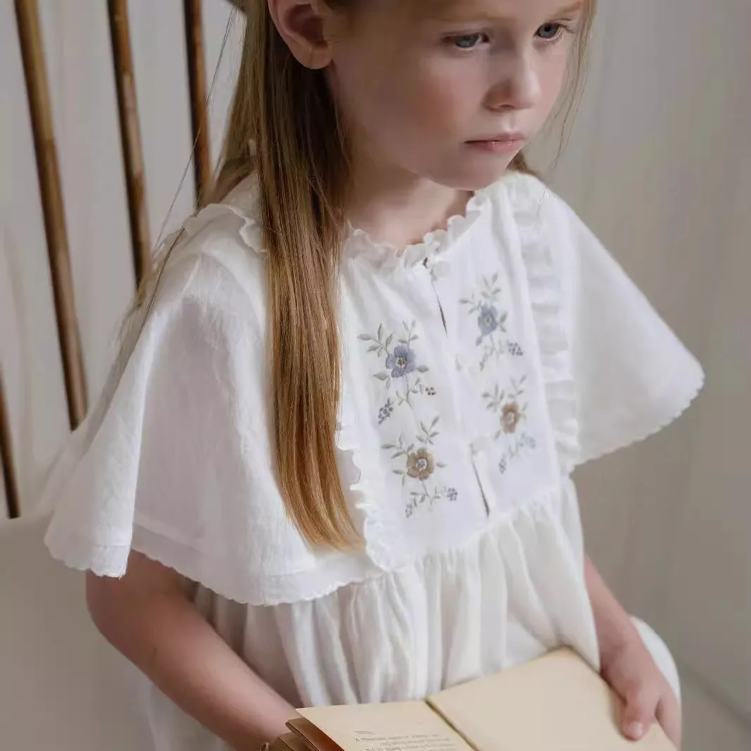 White washed cotton girls dress with short sleeves, ruffled and embroidered skirt for summer