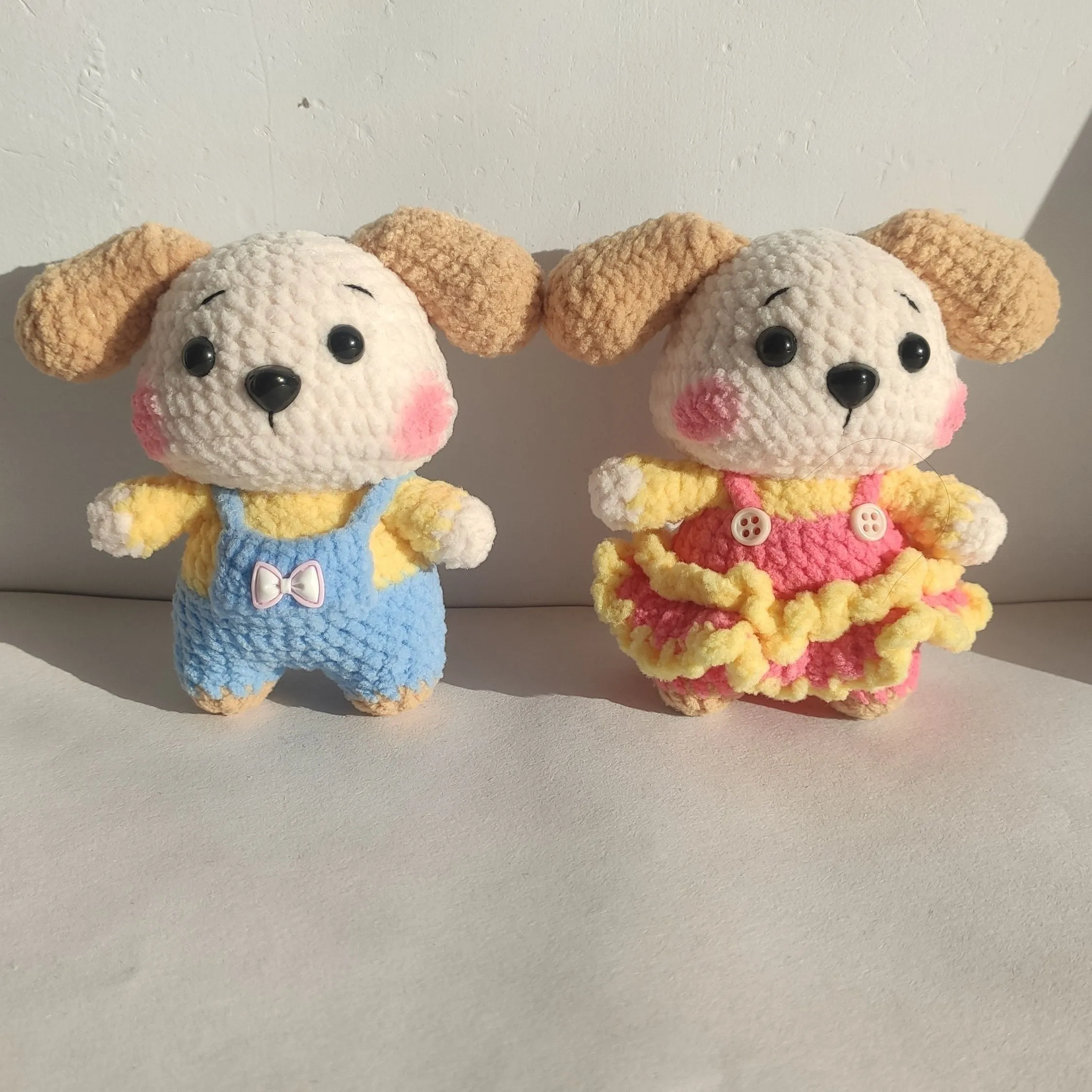 Handmade woollen zodiac dog pendant charm on a keychain, shown in pinafore dress style.