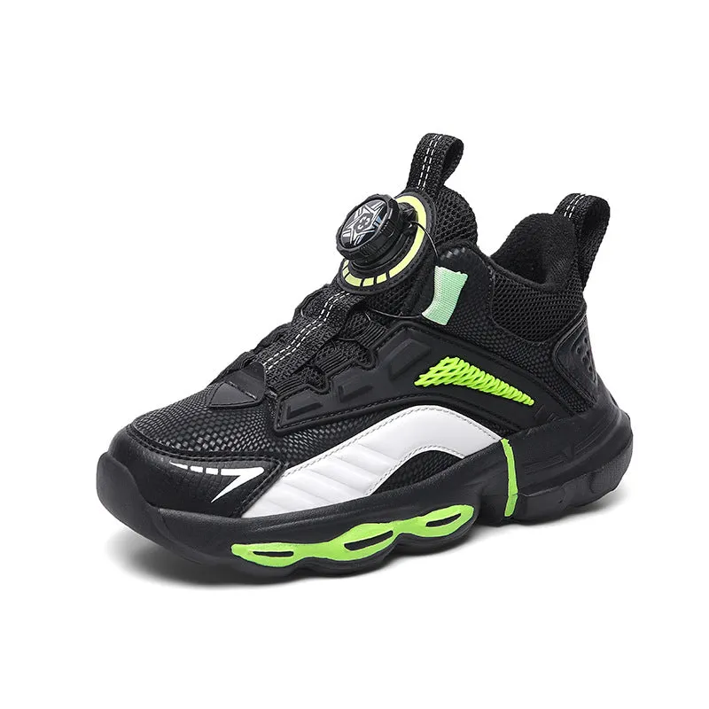 Children's waterproof leather basketball shoes with rotating buckle, black and grey colour, on natural lawn