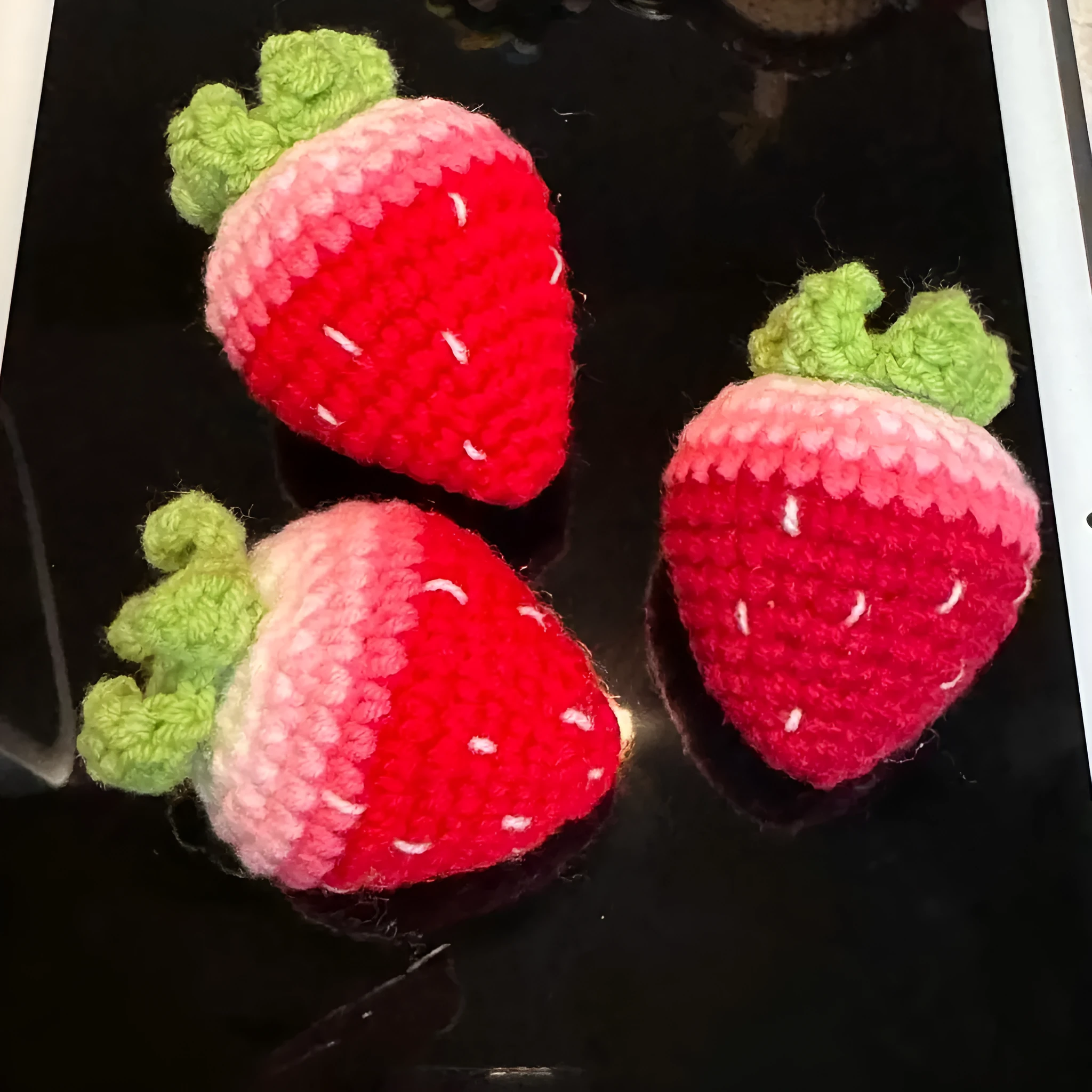 Soft plush strawberry pendant keychain in pink and red colour options with metal ring