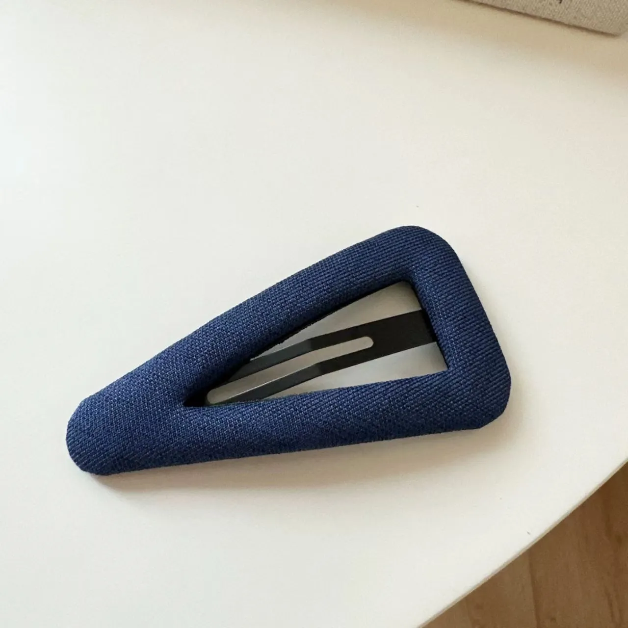French retro style hair barrettes in triangle and water drop shapes with dark denim and polka dot patterns.