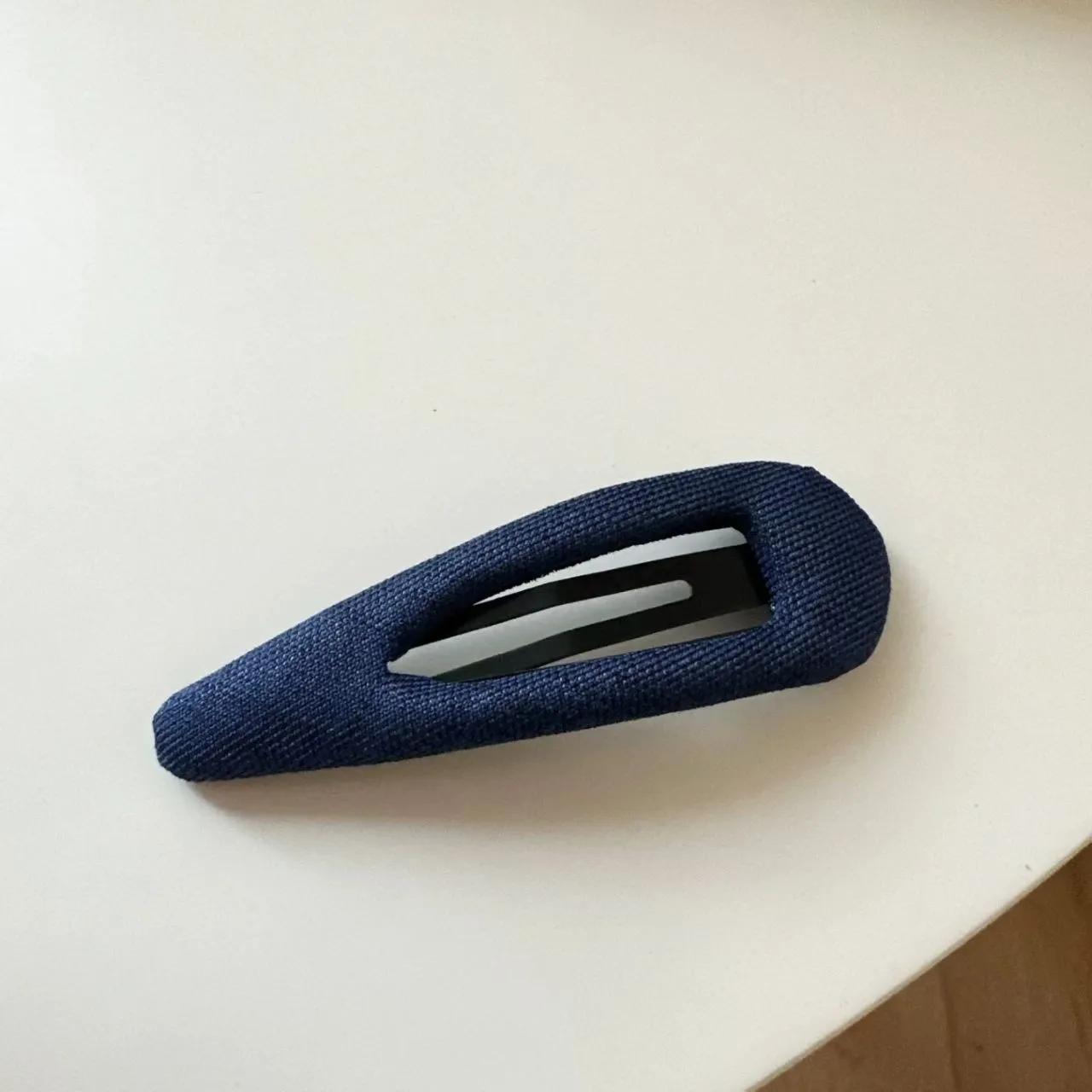 French retro style hair barrettes in triangle and water drop shapes with dark denim and polka dot patterns.