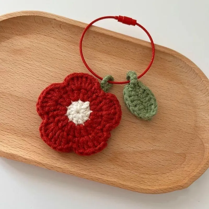 Hand-crocheted wool flower pendant in small red or yellow design for craft and jewellery projects