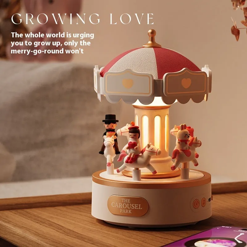 Carousel music box with ambience light showing rotating figurine and USB charging base