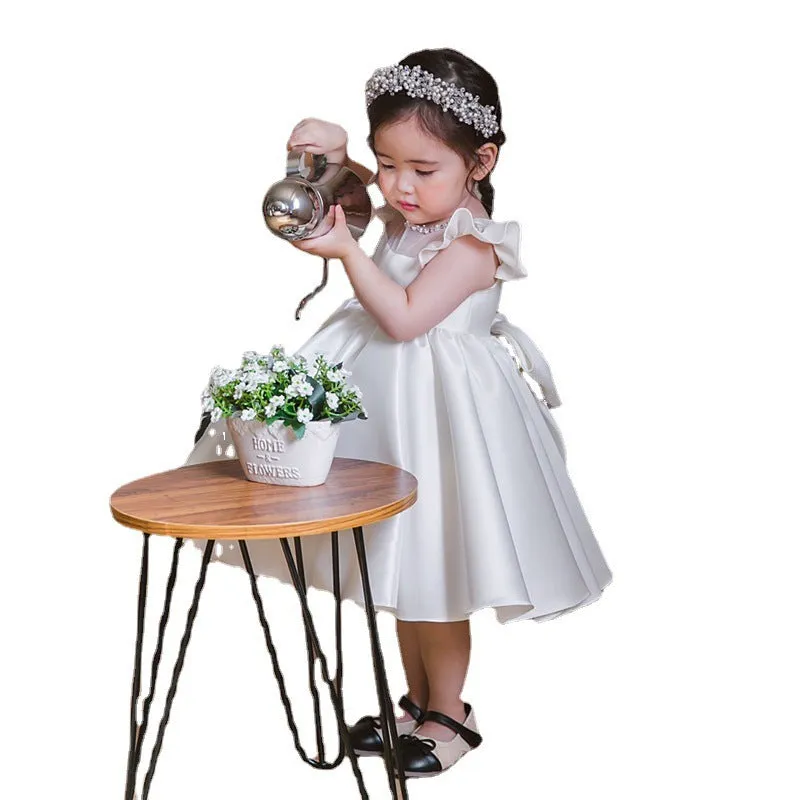 Girls' white satin princess dress with puff sleeves, full-length view, white fabric