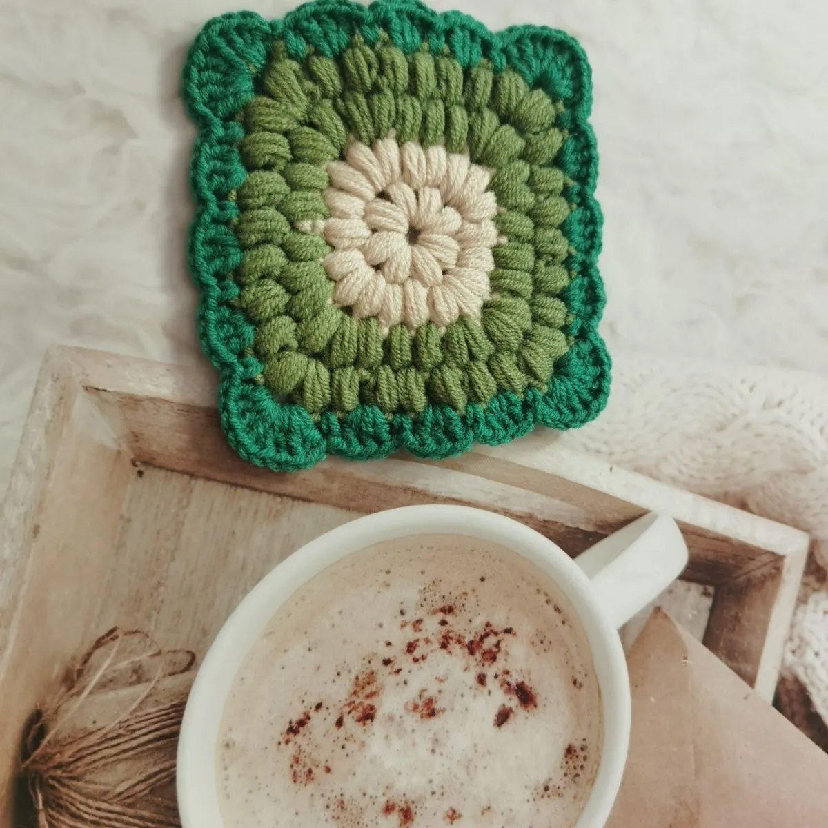 Crocheted wool insulated cup placemat with grandmother lattice pattern in colour choice