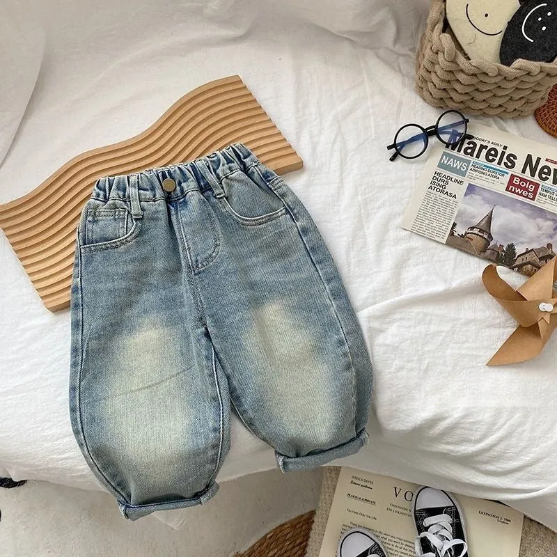 Light-coloured boys denim jeans with printed back pocket and elastic waist, front view