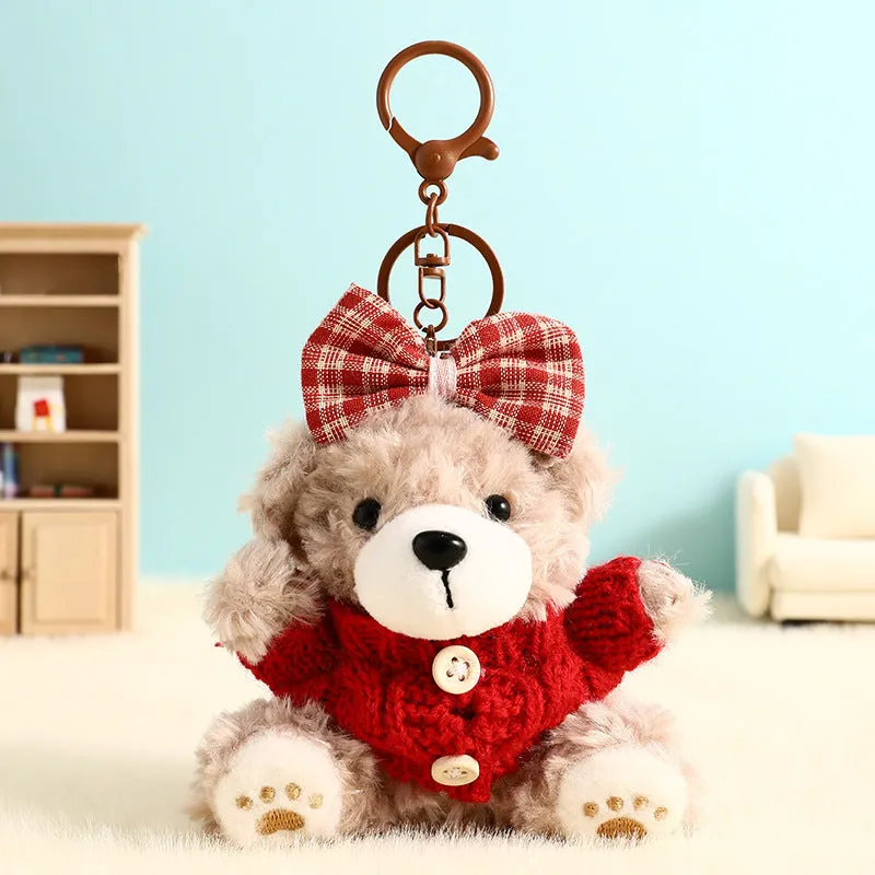 Plush biscuit bear keychain pendant with coloured bow on a soft teddy bear design