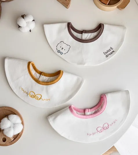 Set of three small cotton baby bibs in assorted colours with waterproof layer for milk spill protection