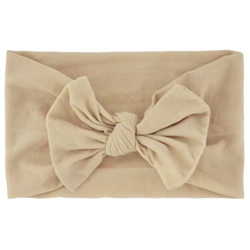 Super stretchy soft knot headband with hair bow for baby girls in one of 22 colours