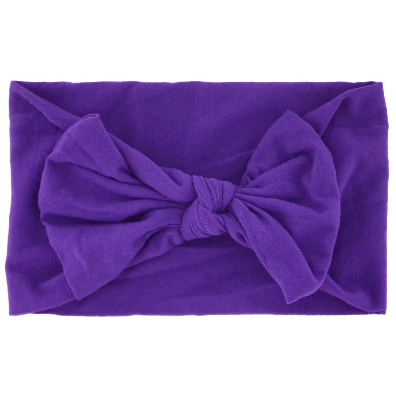 Super stretchy soft knot headband with hair bow for baby girls in one of 22 colours