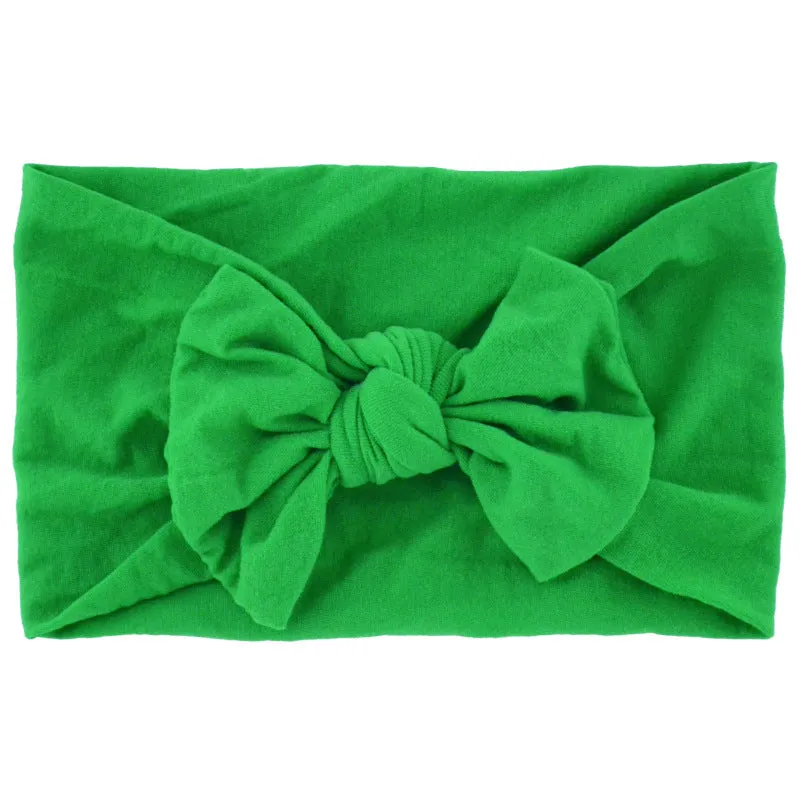 Super stretchy soft knot headband with hair bow for baby girls in one of 22 colours