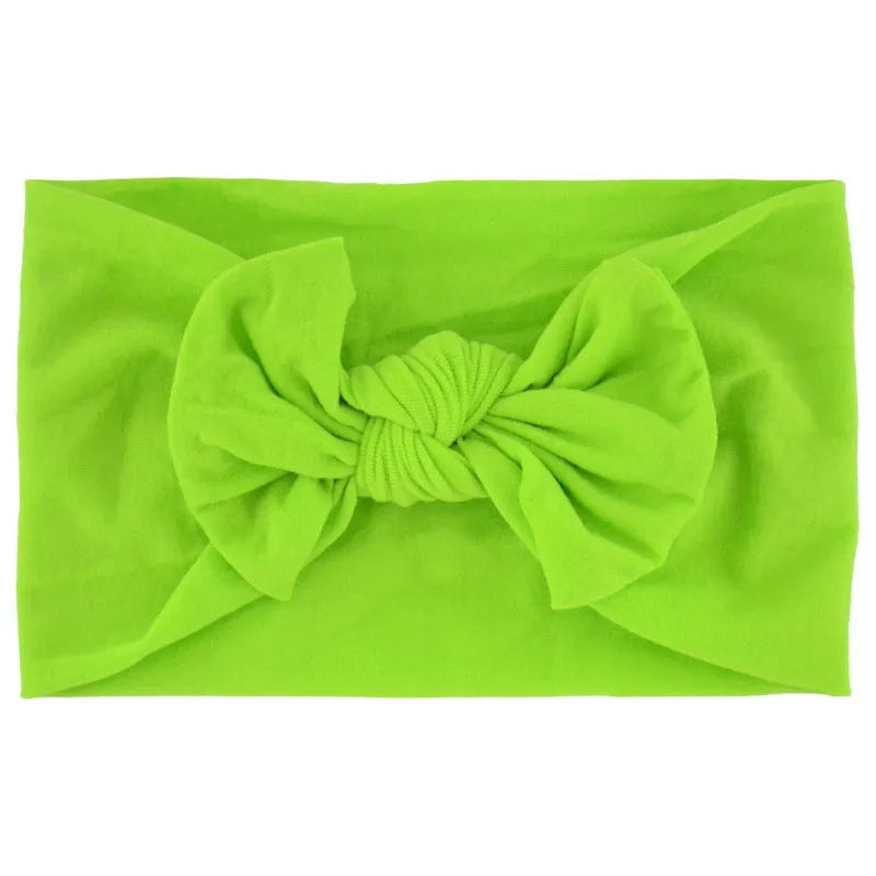 Super stretchy soft knot headband with hair bow for baby girls in one of 22 colours