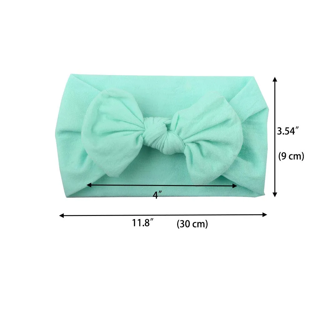 Super stretchy soft knot headband with hair bow for baby girls in one of 22 colours
