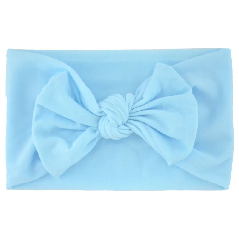 Super stretchy soft knot headband with hair bow for baby girls in one of 22 colours